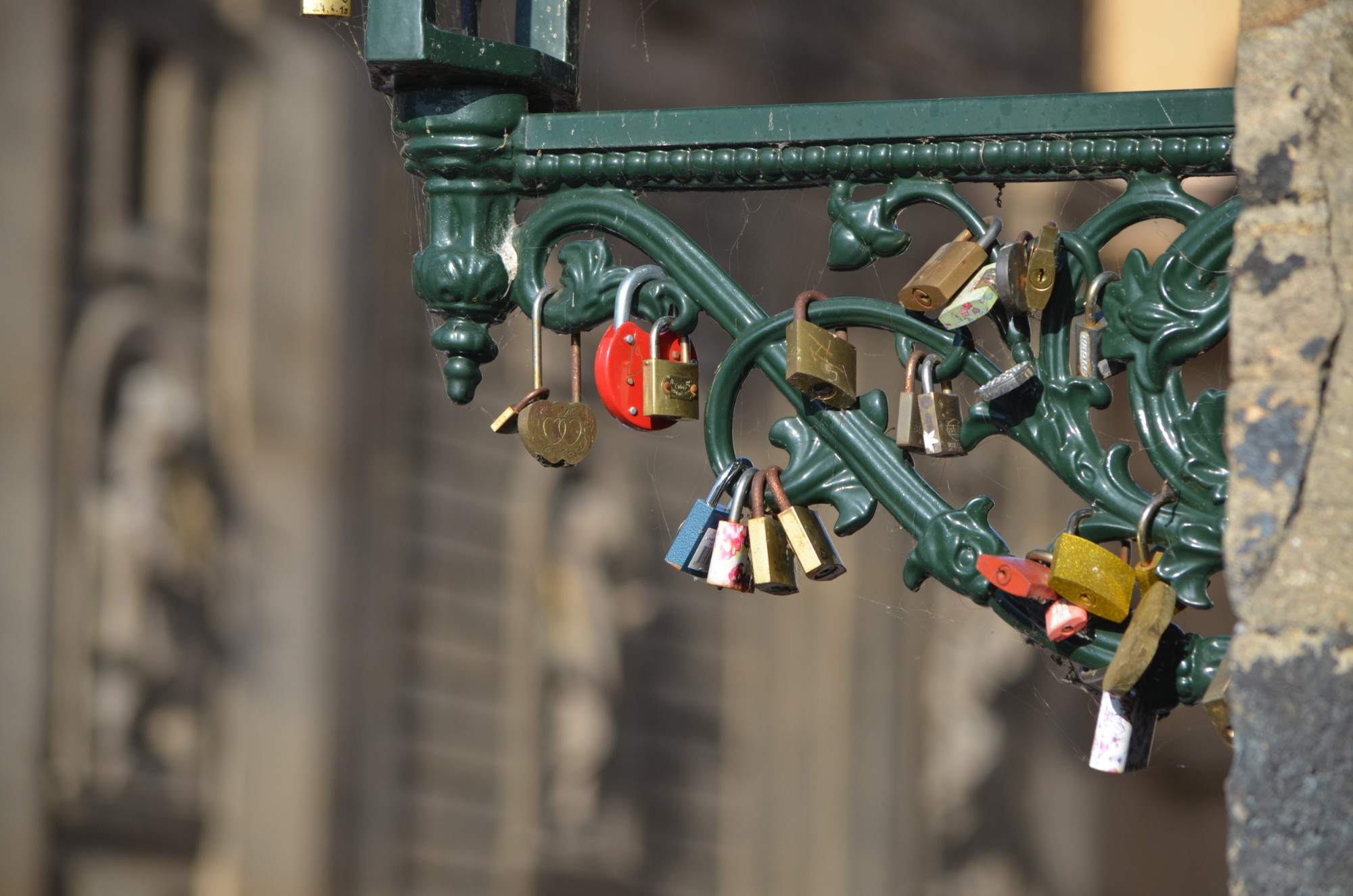 Love locks on a lamp bracket on Charles Bridge