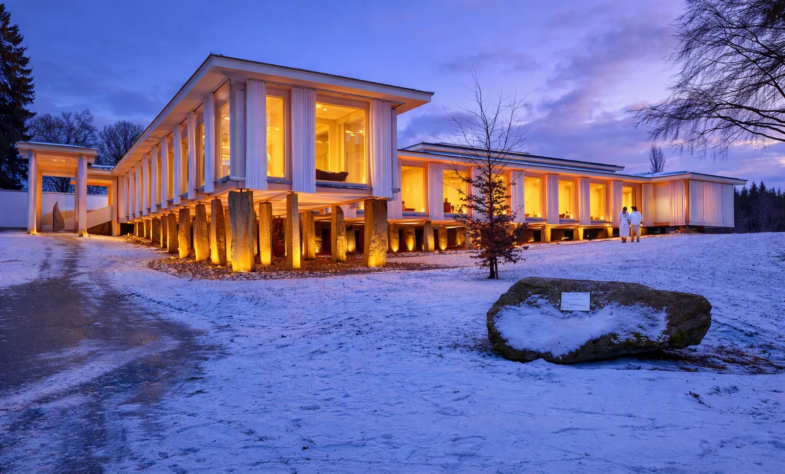Spa pavilion lit up on a winter evening
